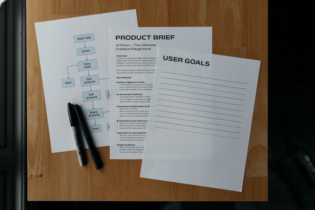 Documents and a pen lay on a wooden surface.