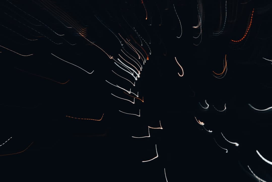 a black background with white and orange lights