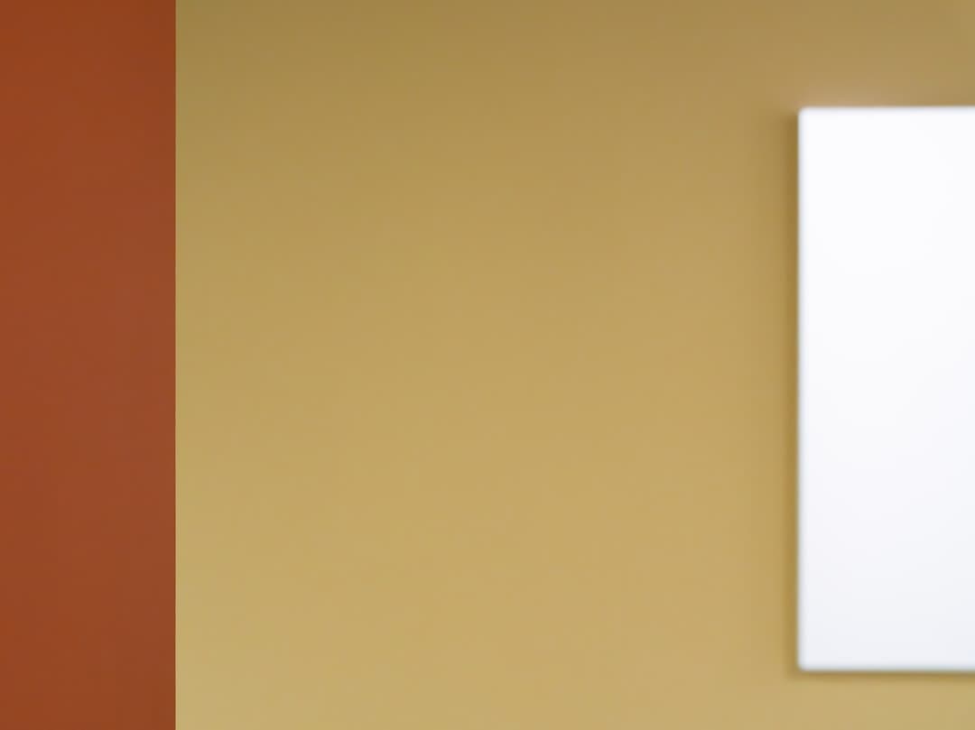 Dual-colored wall with blank white canvas